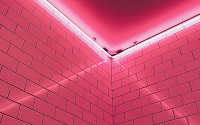 Quiet corner of a gym with neon lights.